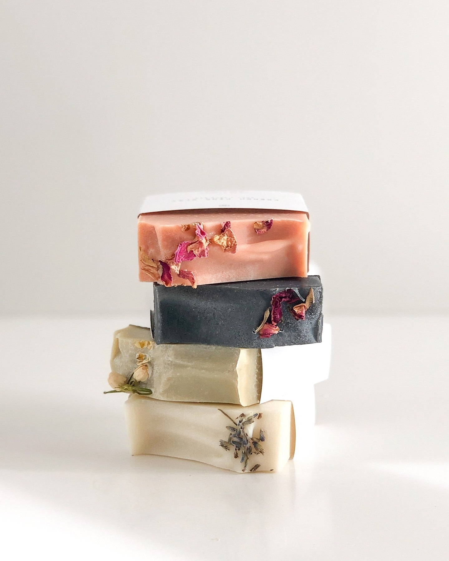 A set of handmade bar soaps for face and body with natural ingredients and essential oils by Agha Studio.