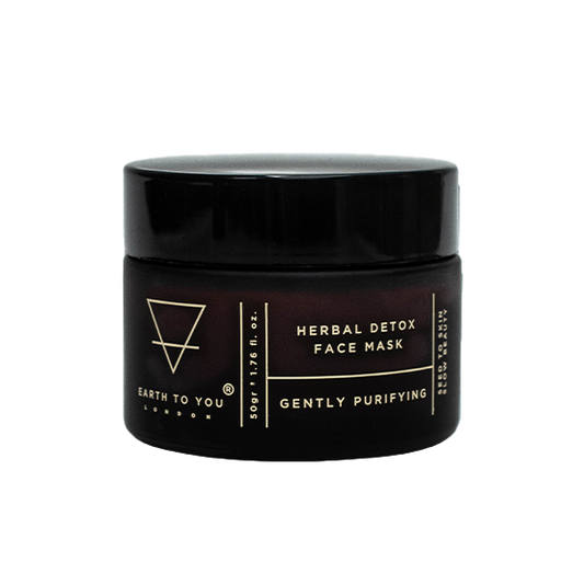 A jar of herbal face mask by Earth To You to detoxify, exfoliate, and cleanse the skin.