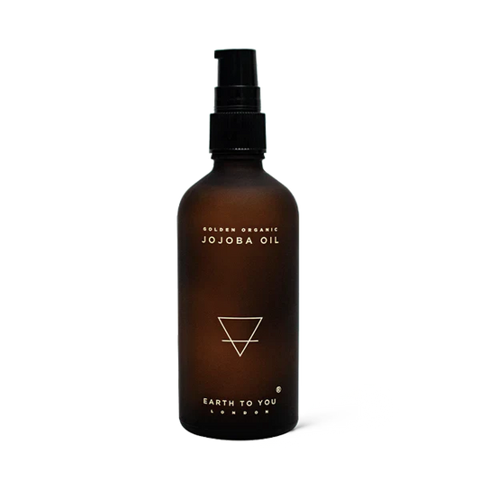 Bottle of organic, cold-pressed, single-ingredient Jojoba face and body oil by Earth To You to replenish and rebalance the skin.