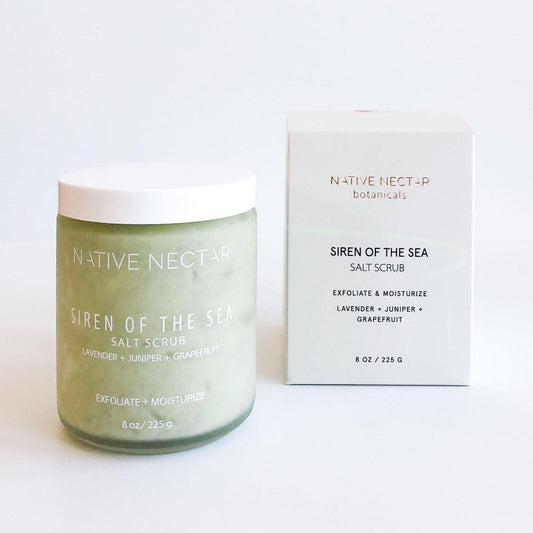 A jar of sea salt body scrub made with minerals and essential oils to exfoliate and moisturize the skin and smooth the body by Native Nectar Botanicals.