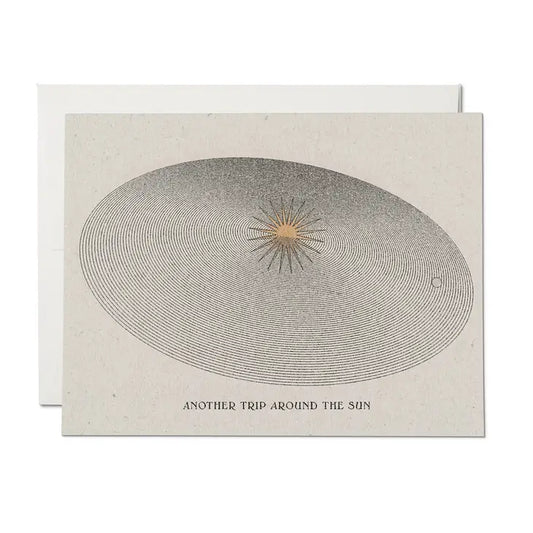 Birthday greeting card by Red Cap Cards, illustrated by Daren Thomas Magee illustrating going around the sun.