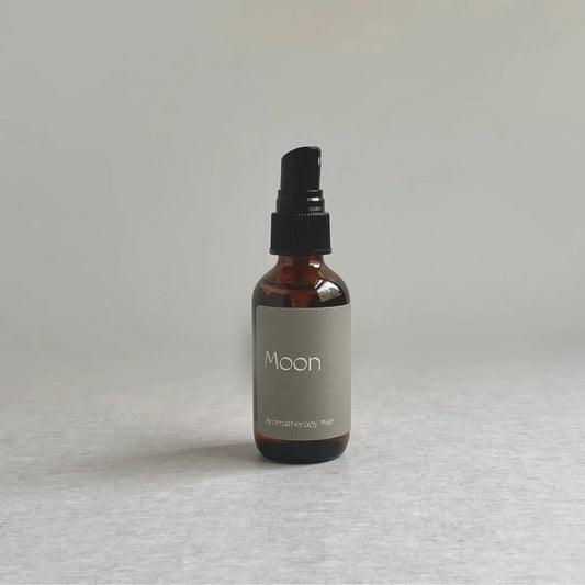 A bottle of linen and room spray made with essential oils of lavender, clary sage, and lemon by Species by the Thousands.